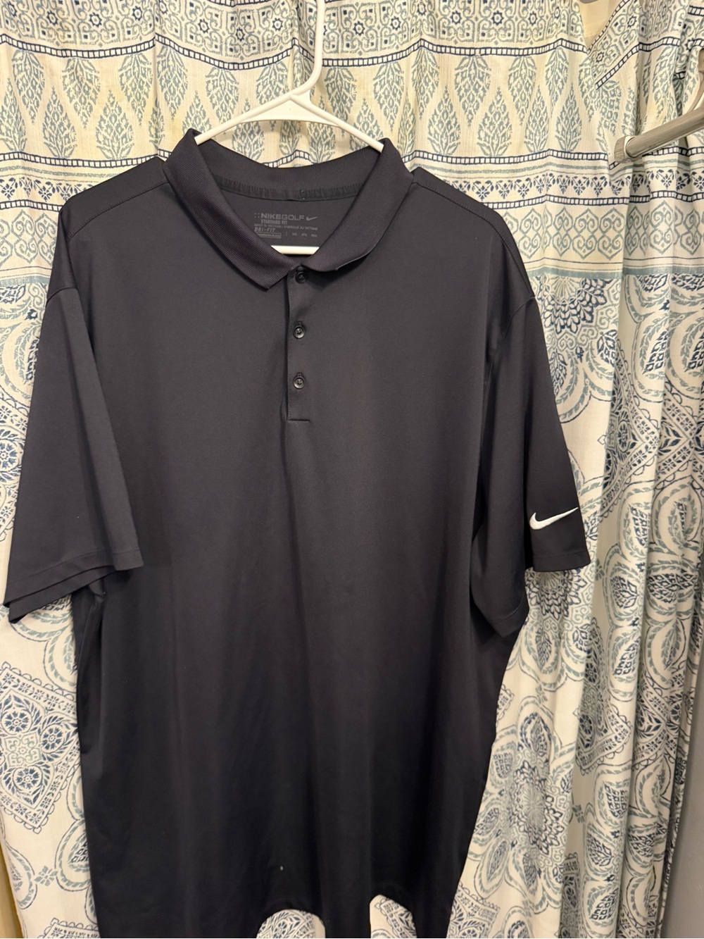 Nike Men’s Navy Polo with White Swoosh